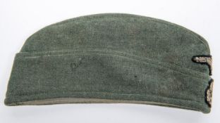 A Third Reich Waffen SS OR's FS cap, woven eagle and swastika. GC (very slight moth damage). £200-