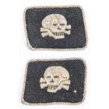 A scarce pair of Third Reich SS collar patches, Totenkopf officer's type, black with silver alloy