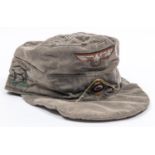 A Third Reich Tropical service peaked field cap, embellished with Afrika Korps designs inside and