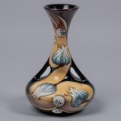 A Moorcroft pottery vase of unusual shape. Stylised flowers design by Sian Leeper. Marks to base,