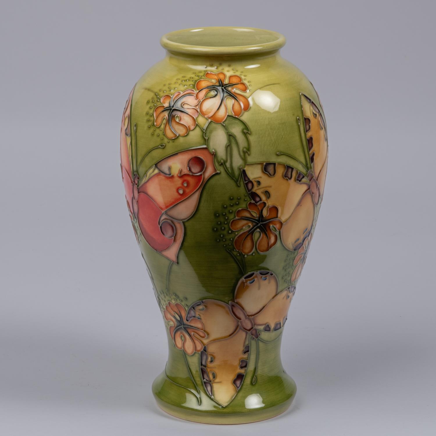 A Moorcroft pottery vase from 1994. A trial piece with butterfly designs. Marks etc to base with eye - Image 2 of 3