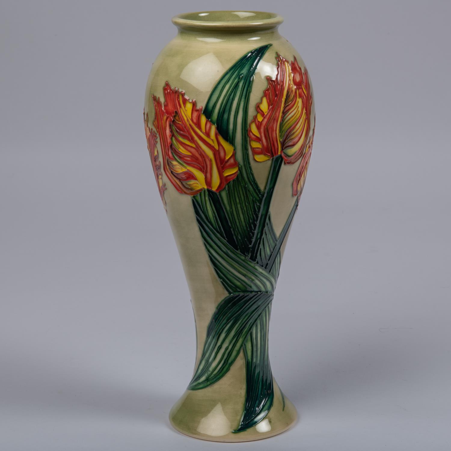 A Moorcroft pottery slim vase. Parrot tulips on a green ground. Impressed marks to base, GP, - Image 3 of 4