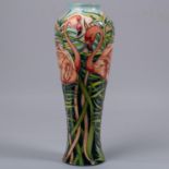 A Moorcroft pottery tall vase. With flamingos in undergrowth. Impressed marks to base, DS, LB,