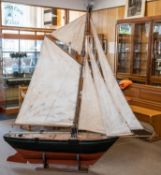 A very large Edwardian/early 20th Century pond yacht. A well constructed pine hull with bitchumen(?)