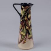 A Moorcroft pottery jug from 2005. With floral design. Marks etc to base with HM and M.C.C. for