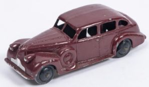 A Dinky Toys 39d Buick Viceroy Saloon in maroon with early metallic laquered baseplate, smooth black