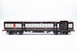 An impressive Royal Mail TPO train made up of a rake of three Gauge Three 2.5 inch gauge LNWR and