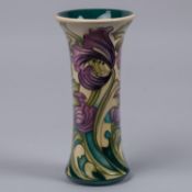 A Moorcroft pottery vase. With liries on cream ground, designed by Kerry Goodwin. Marks to base, HM,