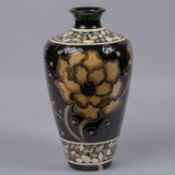 A Moorcroft pottery large vase. Brown flowers on black ground designed by Marie Penkethman. Marks to