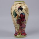 A Moorcroft pottery vase. With Japanese figures on a cream ground. Marks to base, HM, eye date