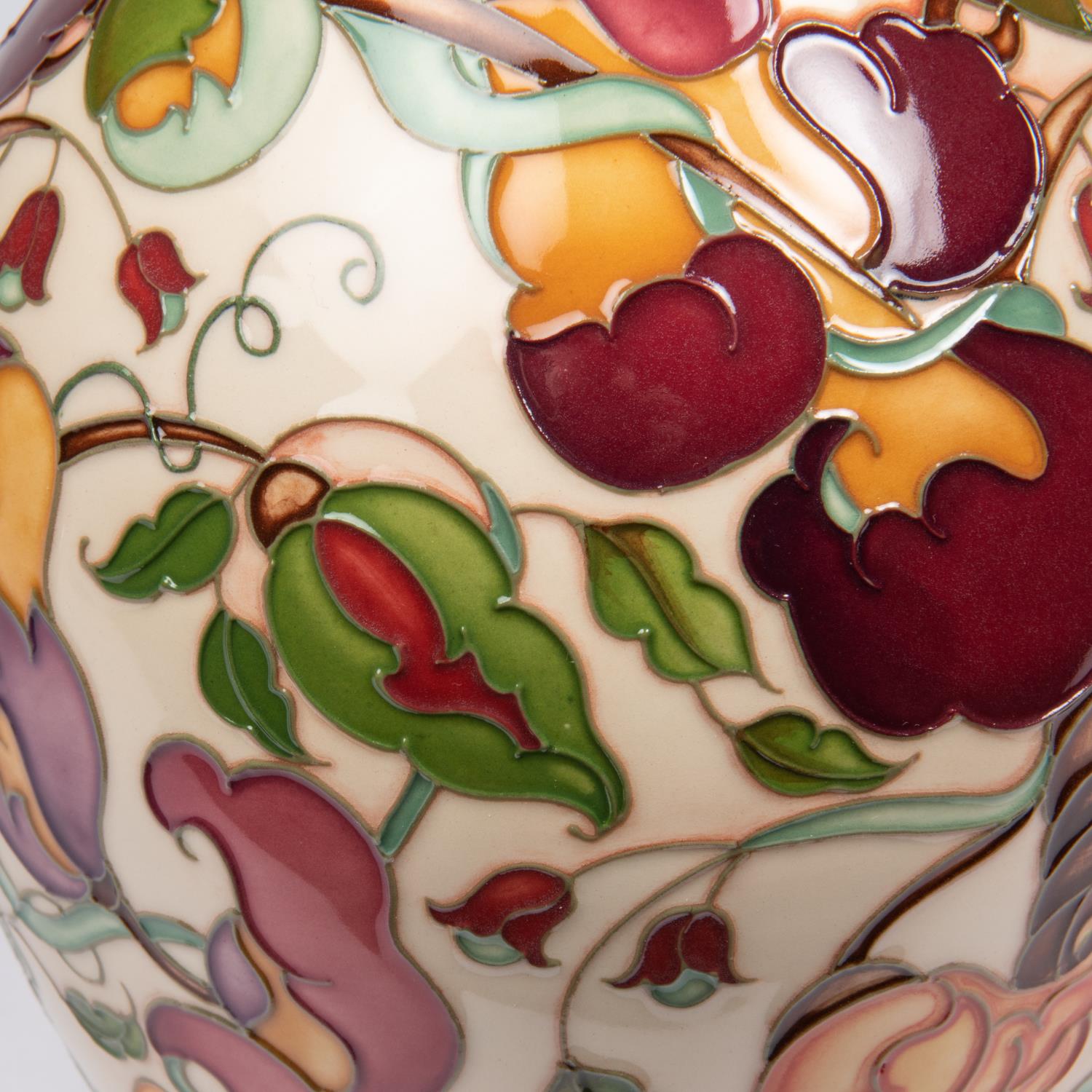 A Moorcroft pottery vase. With a stylised mixed floral design. Marks to base, pineapple date - Image 3 of 4