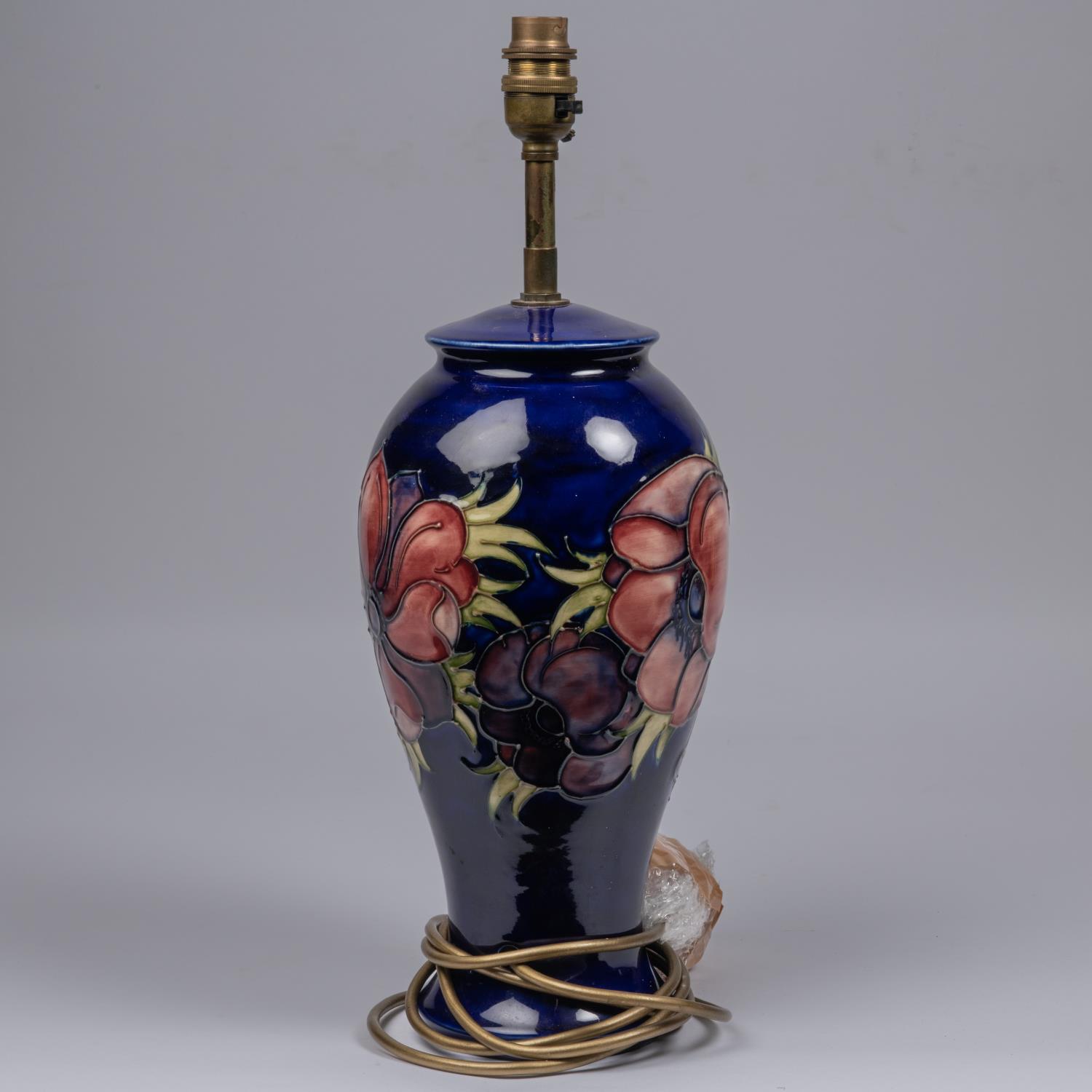 A Moorcroft pottery lamp vase. With anemone design on dark blue ground. Marks to base, MH. H. - Image 2 of 3