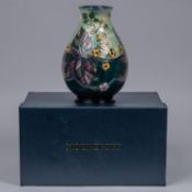 A Moorcroft pottery vase. Brambles with multi-colour berries and purple leaves. Marks to base,