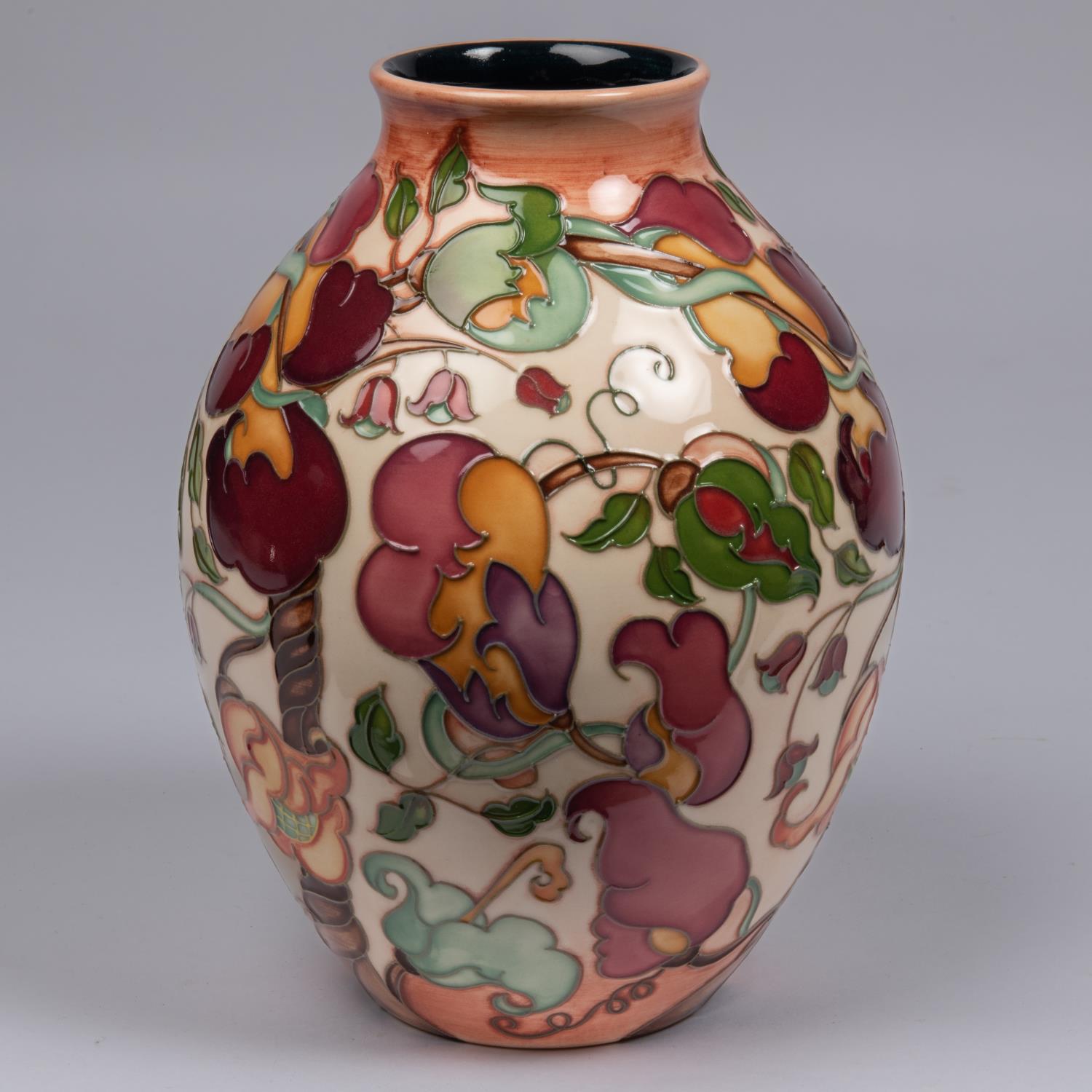 A Moorcroft pottery vase. With a stylised mixed floral design. Marks to base, pineapple date - Image 2 of 4