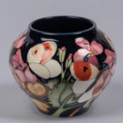 A small Moorcroft pottery vase from 2019. With butterflies and honesty design on purple ground by