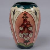 A Moorcroft pottery vase. Trial vase of foxgloves in panels. Impressed marks to base, TRIAL, dated