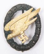A Third Reich Luftwaffe Parachutist badge, with black wreath and gilt eagle, the reverse of the