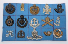 Thirteen military cap badges, including RFC officer's bronze with blades, WM 1st VB Middlesex