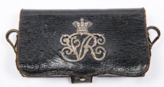 A Victorian officers' leather cartridge pouch, with silver crowned "VR" badge and brass spring