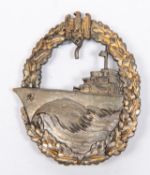 A Third Reich Destroyer War badge, grey with gold wreath, the unmarked reverse slightly concave with