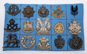 Fifteen military cap badges, including Shropshire VTC Cadets by Fattorini of Bolton; 10th Hussars