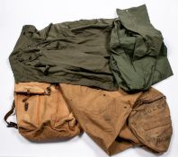 A WWII officers' bedroll dated 1944, another similar, a groundsheet cape, 4 military shirts, 3 pairs