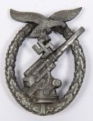 A Third Reich Luftwaffe Flak Gunners' badge, of grey metal with flat back and round pin with wide