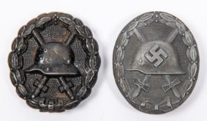 A Third Reich Wound Badge, solid flat back of dull grey zinc; and a WWI black wound badge, hollow