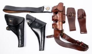 A 1903 pattern 5 pocket ammunition bandolier; 2 black leather .455 revolver holsters; 2 brown
