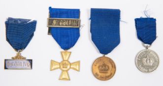 Three Prussian Long Service medals: officer's gilt 15 year cross with F W III bar; 12 years medal;