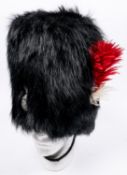 A fine Victorian officer's black bearskin cap of the Northumberland Fusiliers Volunteer battalion,