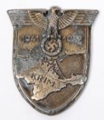 A Third Reich 1941-1942 Krim shield, with 4 bend over blades, 3 small holes for sewing directly onto