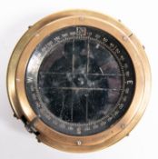 A Type P.8.M. ship's brass compass, No 160693.0., spring mounted in its outer case, 5½" diameter. GC