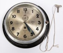 A Third Reich military wall clock, bakelite body with plated face rim, Kriegsmarine eagle and "M" on