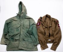 A WWII windproof smock, green colour (faded in patches); a 1949 pattern BD jacket with Airborne