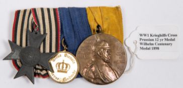 WWI German medal trio: Prussian Kriegshilfe cross, Reserve Landwehr medal 2nd class, and Wilhelm I