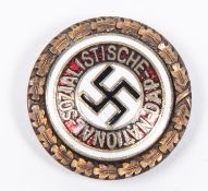 A small size NSDAP gold party badge, the reverse embossed with RZM mark and "BERLIN 1935", GC (un-