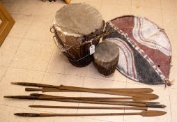 An East African painted shield, possibly Masai, 2 African drums (1 badly damaged), 2 Masai lion