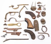 A small quantity of antique and other gun and pistol parts, including brass pistol butt caps,