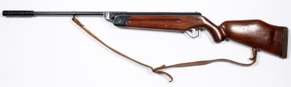 An unidentified .20" break action air rifle, with sound moderator, telescopic sight grooves, and