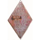 A large diamond shaped cast iron South East and Chatham Railway bridge weight limit sign. Red