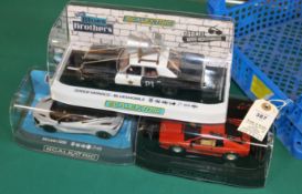 3x new issue Scalextric cars. A Dodge Monaco 'Bluesmobile' from the Movie. A Lotus Esprit Turbo
