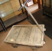 An early 20th Century 4-wheel wooden hand trolley. Industrial trolley for railway etc use by