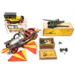 4x items by various makes. Including; a boxed Britains 155mm Field Gun. A 1950s German made Paradise