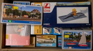 A quantity of Kibri, Vollmer, Faller and Lima HO gauge Buildings and Accessories. Subjects include