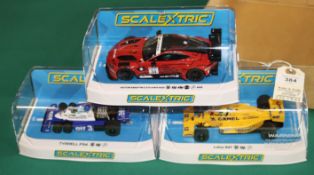 3x new issue Scalextric Racing cars. An Elf Tyrrell P34 F1. Camel Lotus 99T F1. Plus an Aston Martin