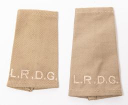 A scarce pair of WWII L.R.D.G. eppaulette slip ons, khaki drill with white lettering. GC £100-120
