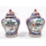 A pair of Chinese ginger jars, 10½" of pottery with lids, colourfully decorated. GC (inner rims