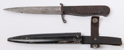 A WWI German trench dagger, Nahkampfmesser, blade 5½", steel hilt with ribbed wooden grips, in its