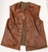 A WWII British Army leather jerkin, khaki serge lined, label damaged but "1942" is legible. GC £60-
